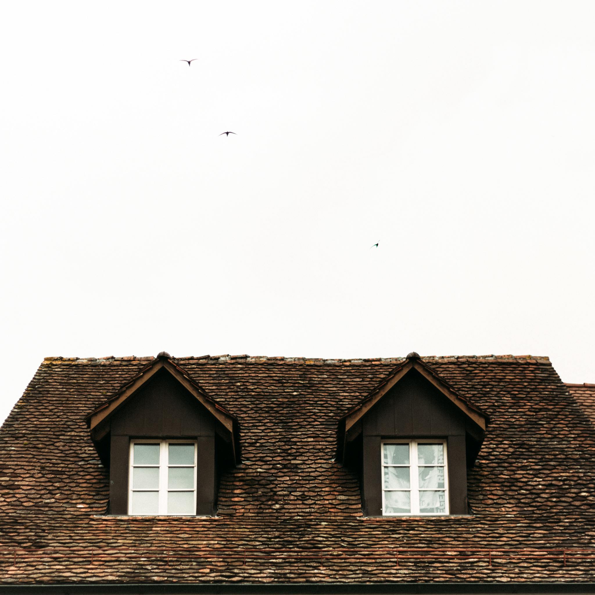 Classic brick roof under clear sky